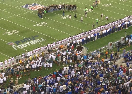 Football Players Disagree with Kaepernick’s Protest of the U.S. National Anthem and Stand in Unison